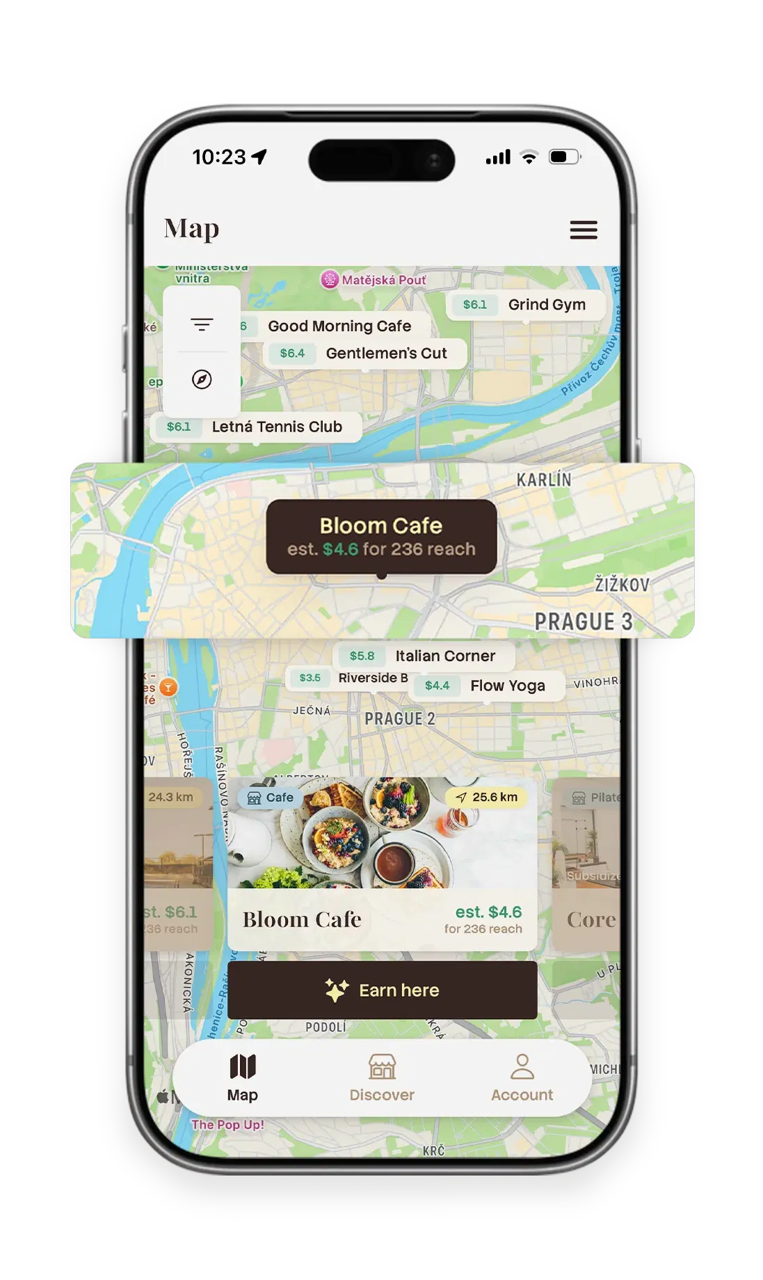 The Tagly app's map of Prague with nearby businesses pinned, each showing an estimated reward, and an Earn here button on the selected cafe